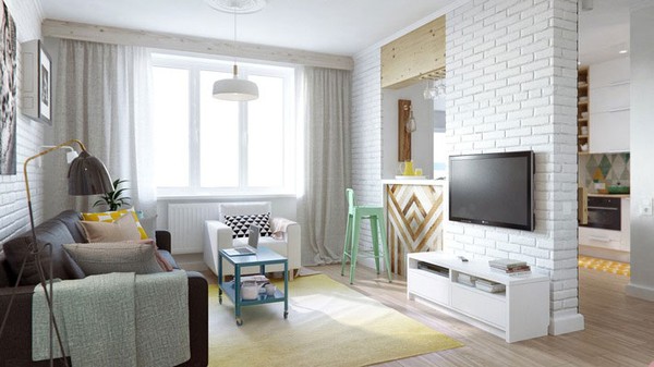 Khu vực tiếp khách và bếp của căn hộ này được phân chia bằng một quầy bar nhỏ và một bức tường decor rất đẹp mắt, tạo không gian thoáng mát cho căn bếp.